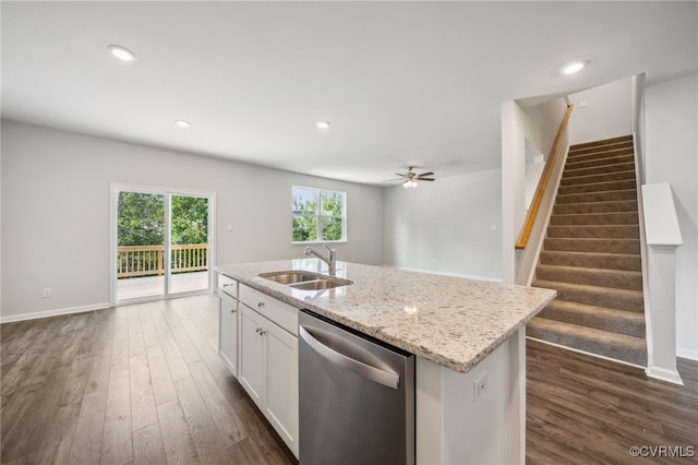 kitchen with dishwasher, sink, white cabinets, dark wood-type flooring, and a kitchen island with sink