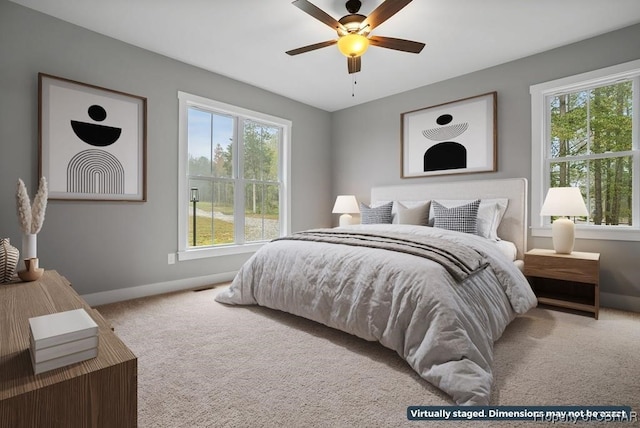 carpeted bedroom with ceiling fan