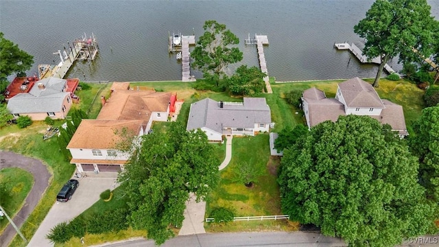 bird's eye view featuring a water view and a residential view