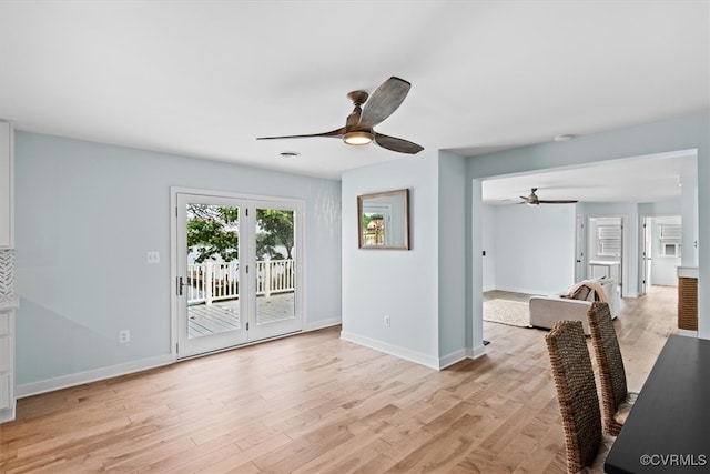 interior space featuring french doors, light hardwood / wood-style flooring, and ceiling fan