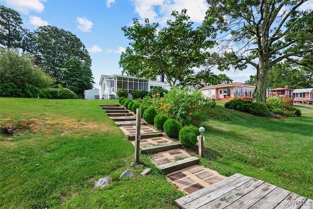 view of yard with a sunroom