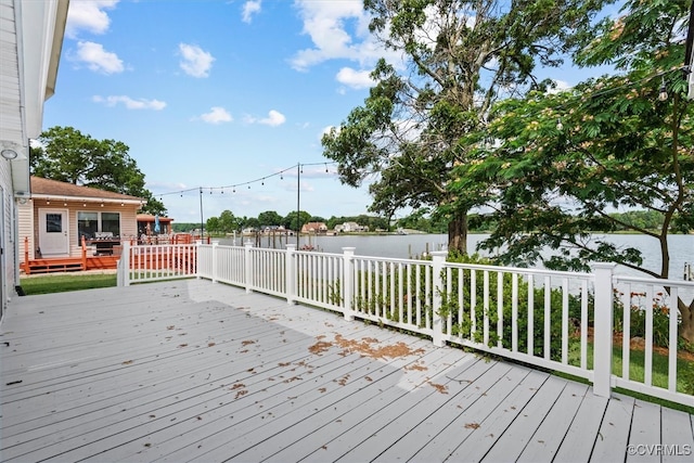 wooden terrace with a water view