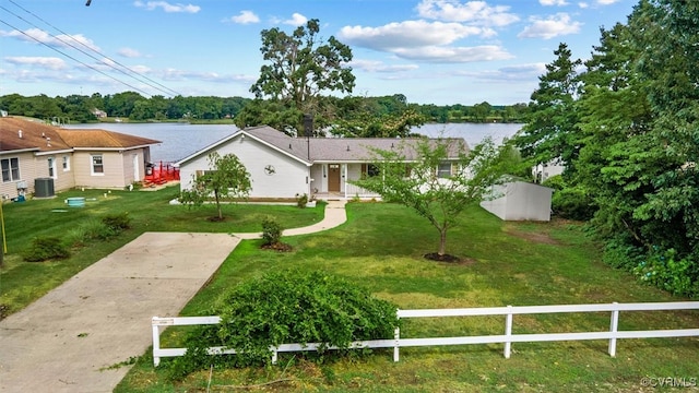 single story home with a water view and a front yard