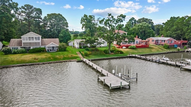 dock area with a water view and a lawn