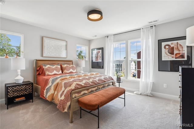 bedroom featuring light carpet