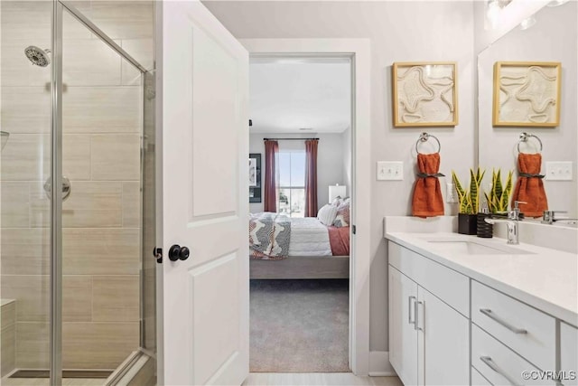 bathroom with an enclosed shower and vanity