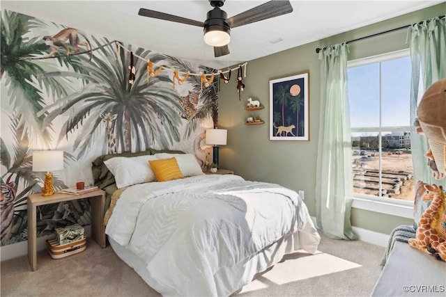 bedroom with light carpet and ceiling fan