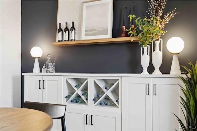 bar with white cabinetry