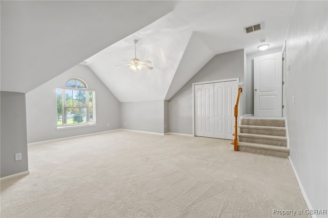 bonus room featuring vaulted ceiling, light colored carpet, and ceiling fan