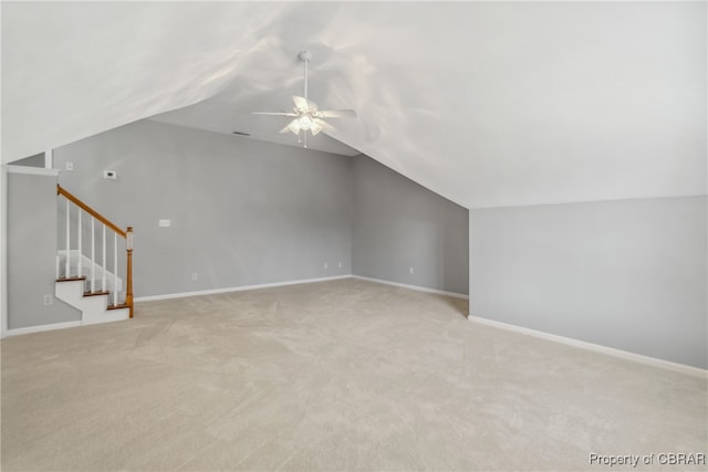 additional living space with light carpet, lofted ceiling, and ceiling fan