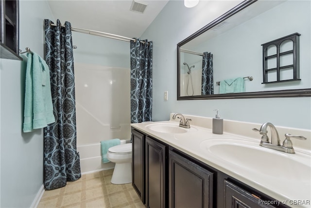 full bathroom with toilet, shower / bath combination with curtain, and vanity