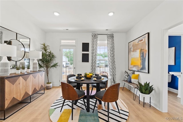 dining room with light hardwood / wood-style flooring