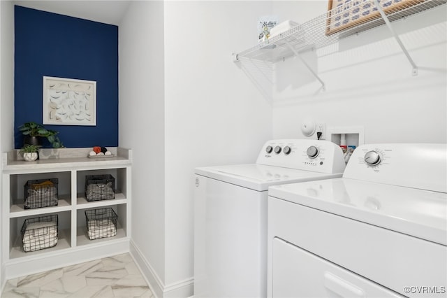 clothes washing area featuring separate washer and dryer