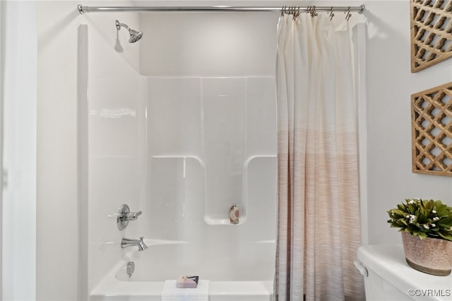 bathroom with toilet and shower / bath combo with shower curtain