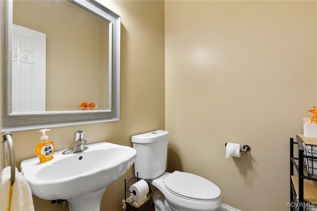 bathroom with sink and toilet