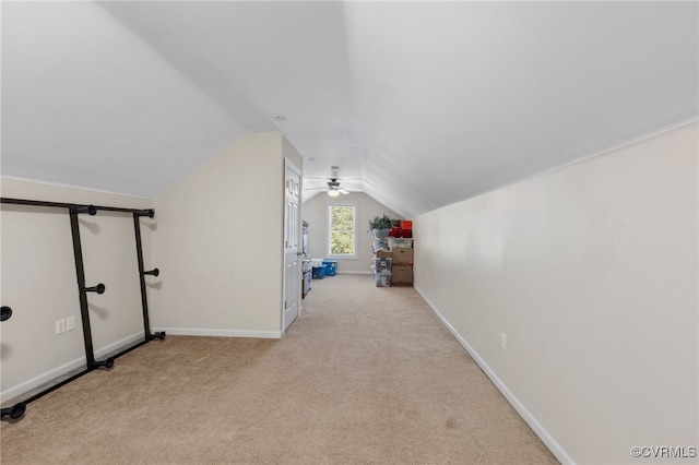 bonus room featuring light carpet, lofted ceiling, and ceiling fan