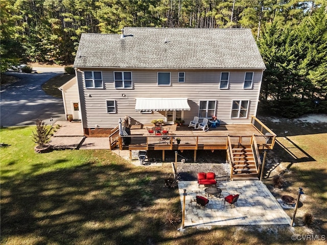 back of house with a patio area, a deck, and a lawn