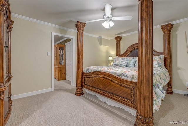 bedroom featuring ceiling fan, ornamental molding, and light colored carpet