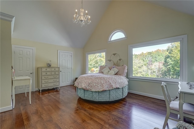 bedroom featuring an inviting chandelier, high vaulted ceiling, and dark hardwood / wood-style flooring