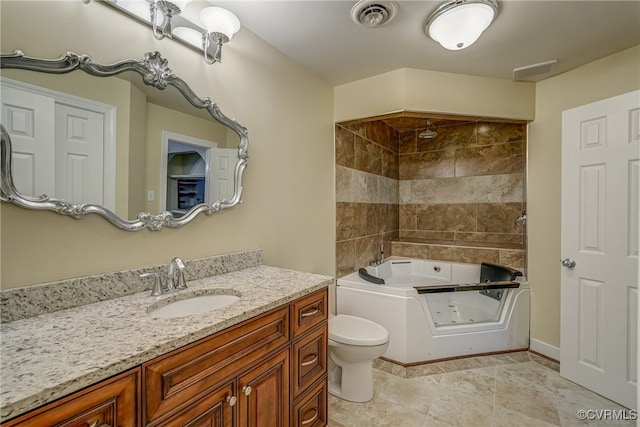 full bathroom featuring vanity, toilet, tile patterned floors, and tiled shower / bath