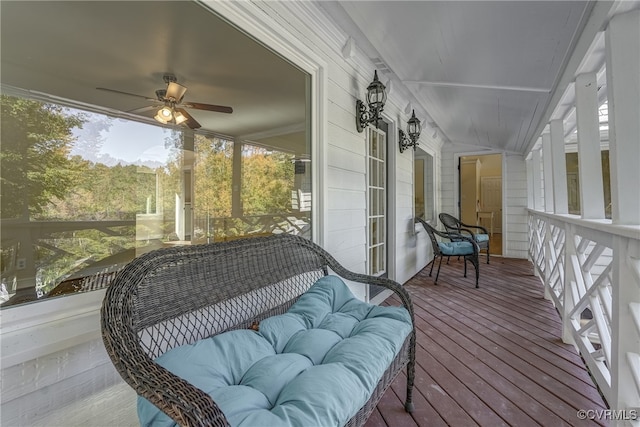 exterior space featuring ceiling fan and lofted ceiling