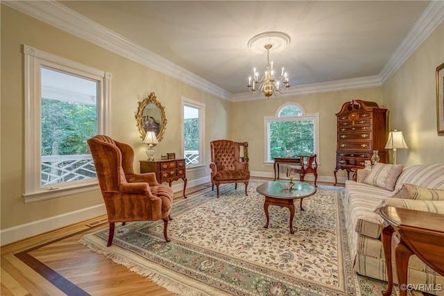 living area with crown molding, hardwood / wood-style floors, and a chandelier