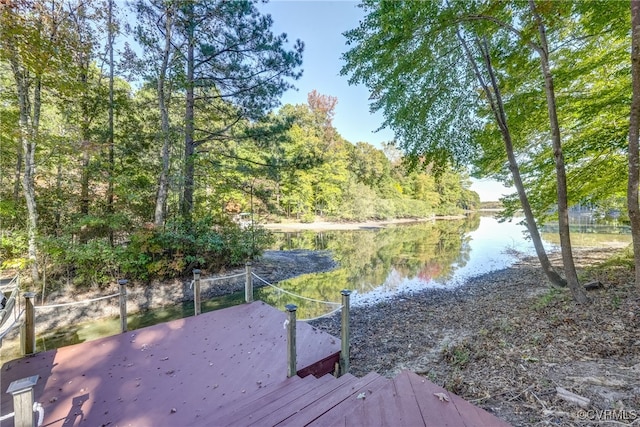 dock area featuring a deck with water view