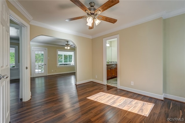 spare room featuring ornamental molding, dark hardwood / wood-style floors, and ceiling fan