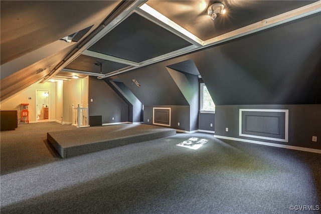 additional living space featuring carpet and vaulted ceiling