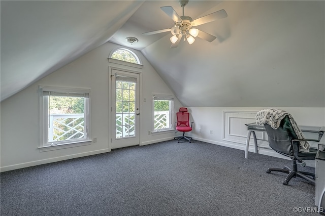 unfurnished office with vaulted ceiling, carpet floors, and ceiling fan