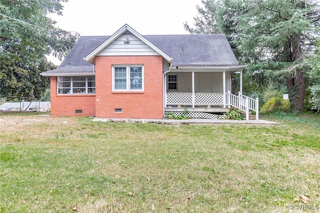 view of front of house with a front lawn and a porch