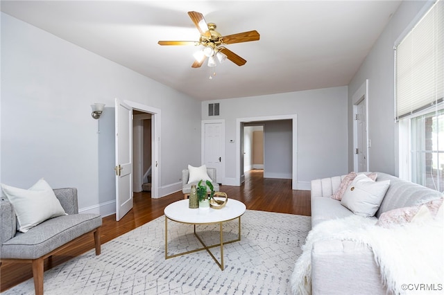 living room with ceiling fan and hardwood / wood-style floors