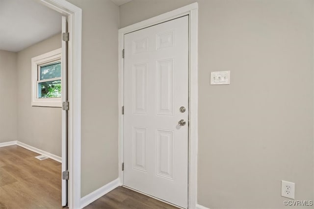 doorway to outside featuring wood-type flooring