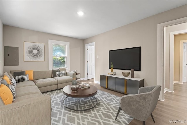 living room featuring electric panel and hardwood / wood-style flooring