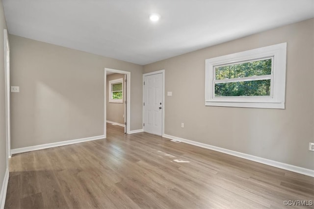 unfurnished room featuring light hardwood / wood-style flooring