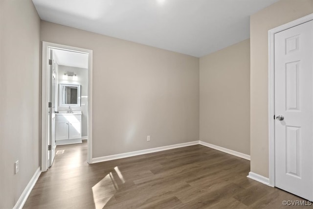 spare room featuring dark hardwood / wood-style flooring