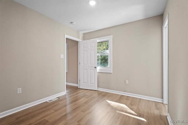 unfurnished bedroom featuring light wood-type flooring