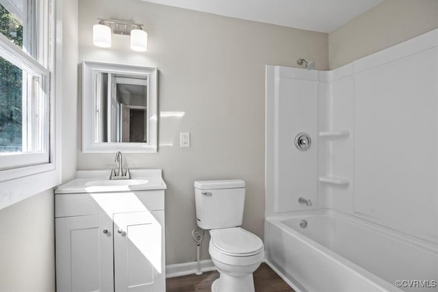 full bathroom featuring toilet, vanity, wood-type flooring, and shower / bathtub combination