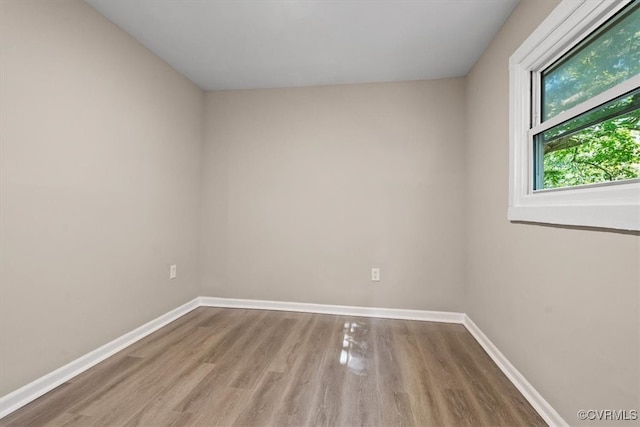 spare room with light hardwood / wood-style floors