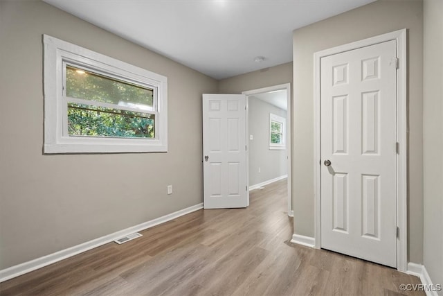 unfurnished bedroom with light hardwood / wood-style flooring