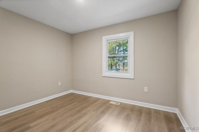 unfurnished room featuring light wood-type flooring