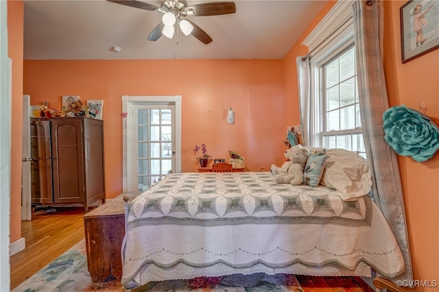 bedroom featuring ceiling fan and light hardwood / wood-style flooring