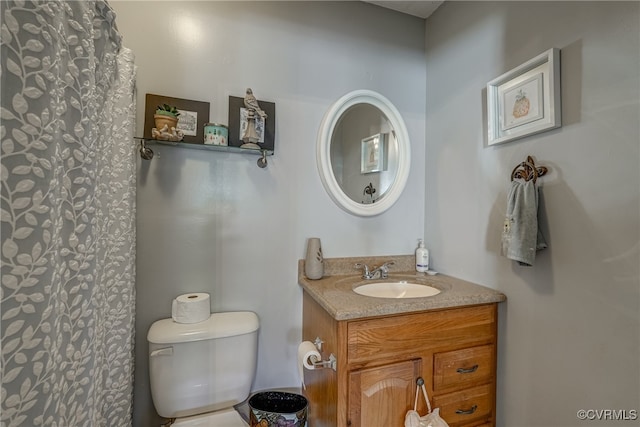 bathroom with toilet and vanity