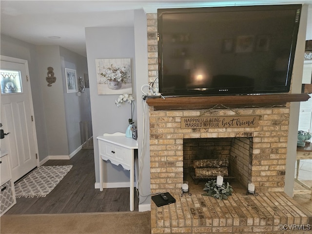 interior details with wood-type flooring and a fireplace