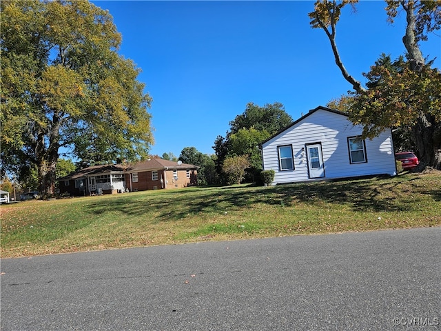 ranch-style home with a carport and a front yard