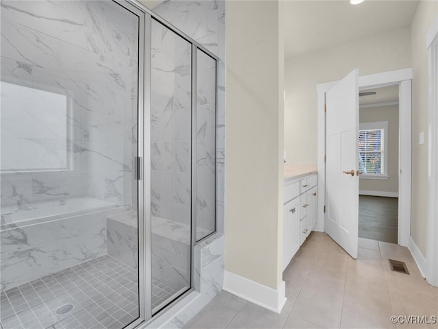 bathroom featuring tile patterned floors, vanity, and independent shower and bath