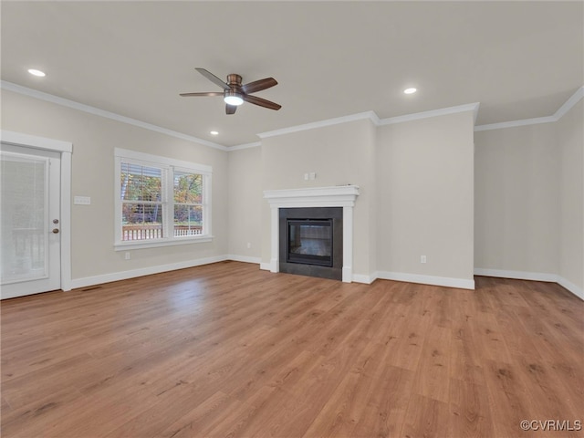 unfurnished living room featuring ceiling fan, light wood-type flooring, and ornamental molding