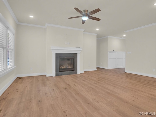 unfurnished living room with ceiling fan, crown molding, and light hardwood / wood-style flooring