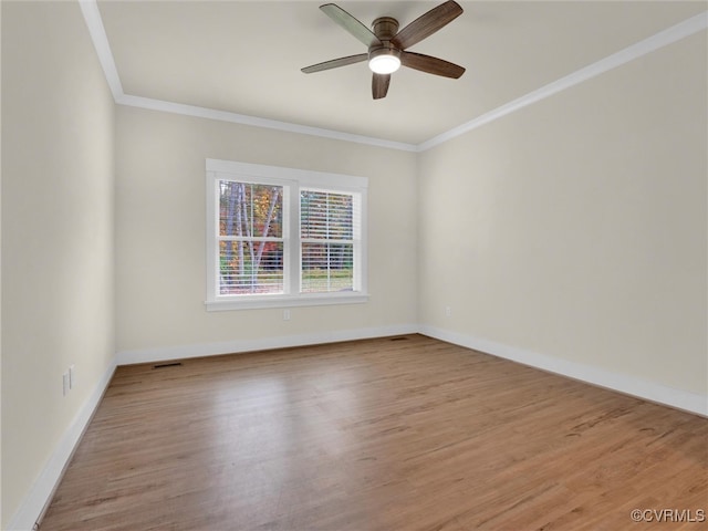 unfurnished room with ceiling fan, light hardwood / wood-style flooring, and ornamental molding