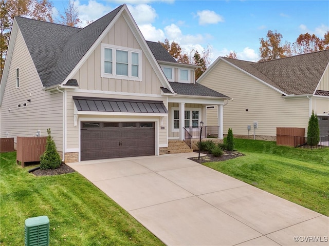 view of front of home with a garage and a front yard